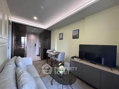 Modern living room with sleek furniture and ambient lighting in a stylish apartment.