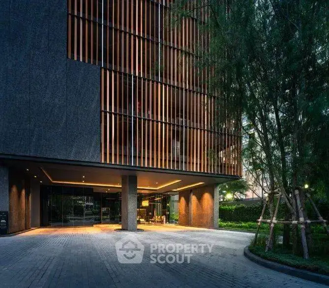 Modern building entrance with sleek design and ambient lighting