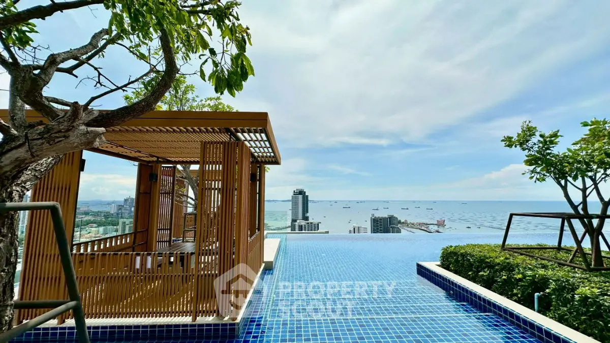 Luxurious rooftop pool with stunning ocean view and modern cabana, perfect for relaxation and leisure.