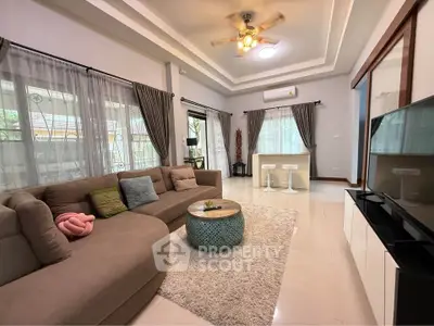 Spacious living room with modern decor and natural light