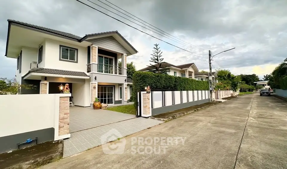 Stunning two-story house with modern design and spacious driveway in a serene neighborhood.