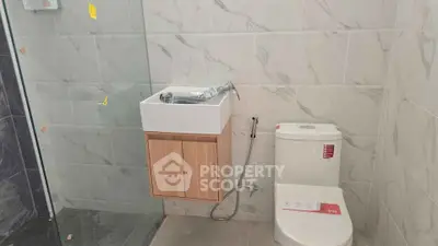Modern bathroom with sleek fixtures and marble tile design