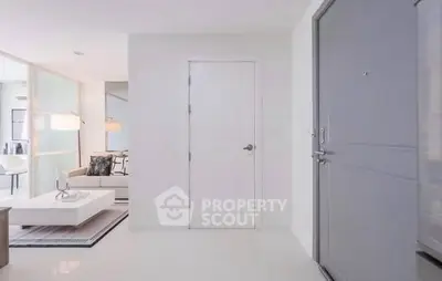 Modern apartment entrance with sleek living room and stylish decor
