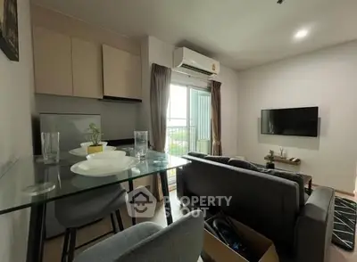 Modern living room with balcony view and sleek furniture design.