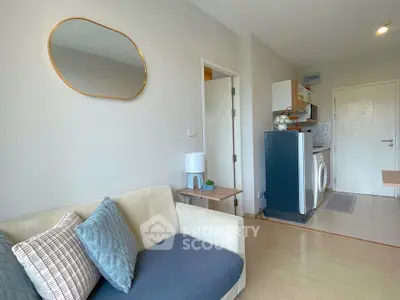 Cozy living room with modern decor and washing machine in compact apartment
