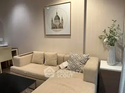 Cozy living room with modern beige sofa and elegant wall art