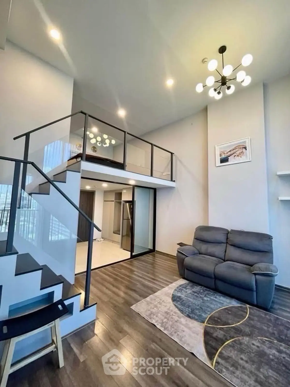 Modern loft-style living room with high ceilings and stylish decor
