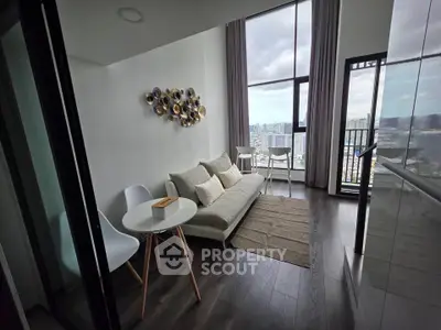 Modern living room with floor-to-ceiling windows and city view