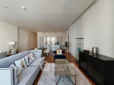 Spacious modern living room with elegant decor and open kitchen layout