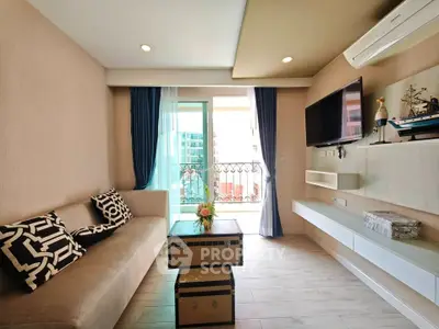 Modern living room with stylish decor and balcony access in a contemporary apartment.