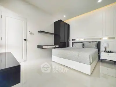 Modern minimalist bedroom with sleek furniture and neutral tones