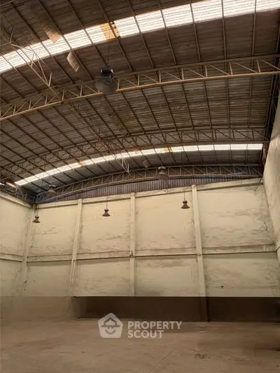 Spacious industrial warehouse with high ceilings and ample natural light