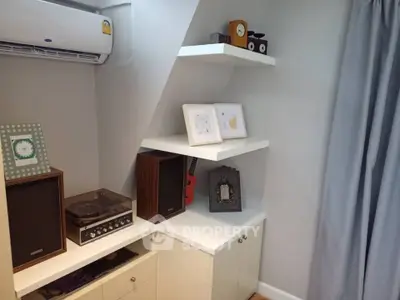 Charming corner unit with stylish shelving and modern decor, perfect for cozy living spaces.