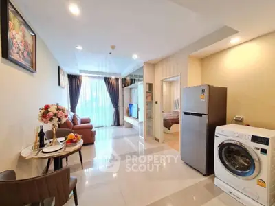 Spacious modern living room with open layout, featuring stylish furniture and appliances, perfect for comfortable living.