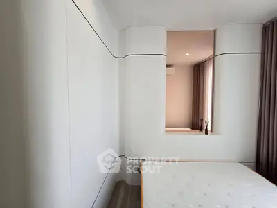 Modern minimalist bedroom with sleek design and neutral tones