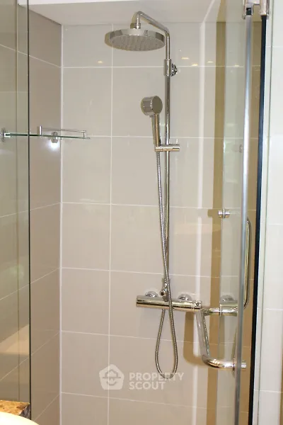 Modern bathroom with sleek shower fixtures and glass enclosure