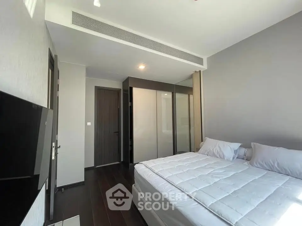 Modern bedroom with sleek design and ample natural light