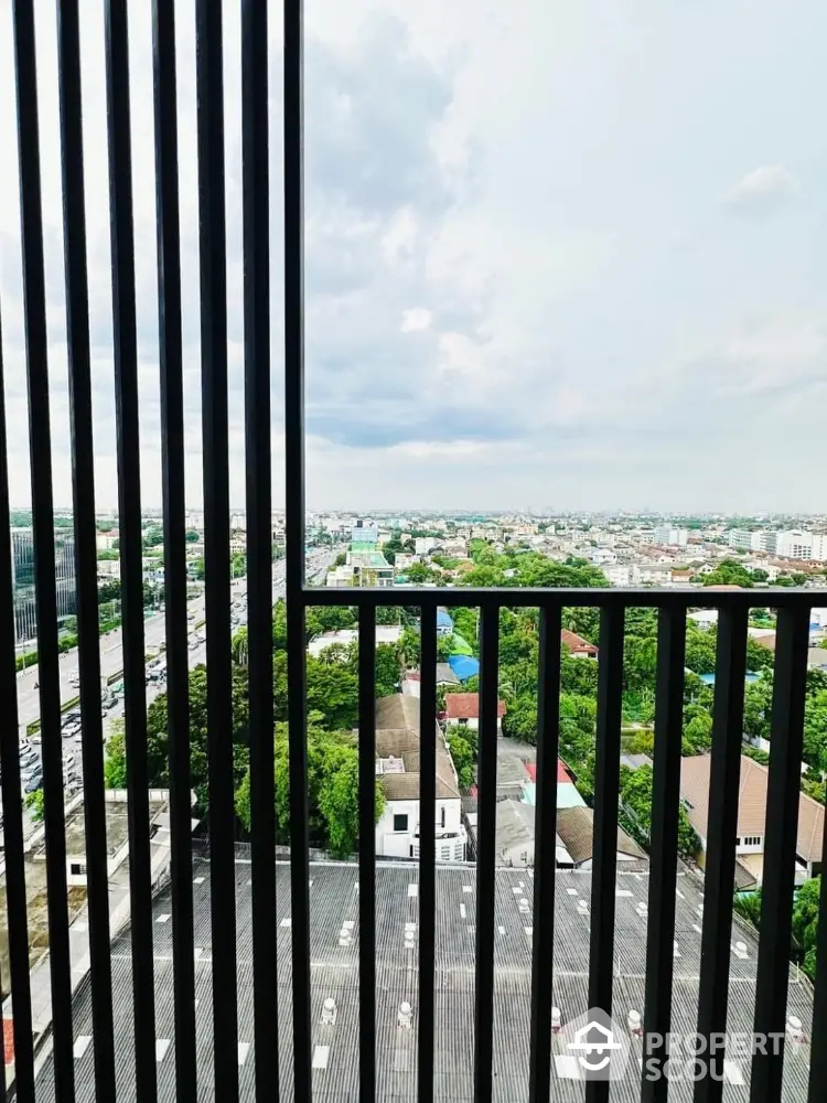 Stunning cityscape view from high-rise balcony with expansive skyline and lush greenery.