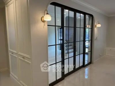 Elegant interior with glass sliding doors and modern lighting