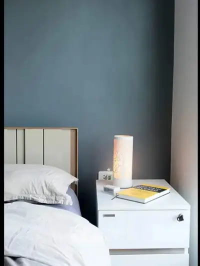 Cozy bedroom with modern nightstand and ambient lighting