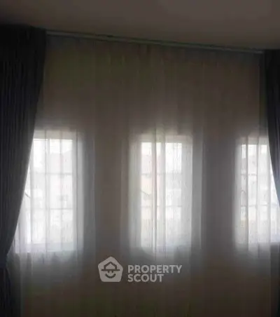Elegant window with sheer curtains in a cozy interior setting