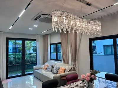 Luxurious living room with elegant chandelier and modern decor