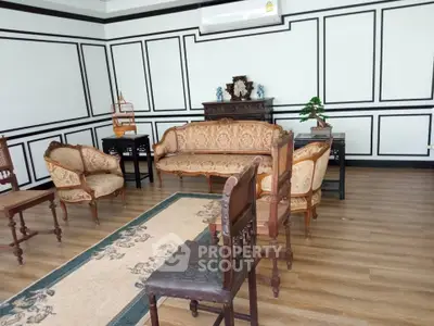 Elegant vintage living room with classic furniture and wooden flooring