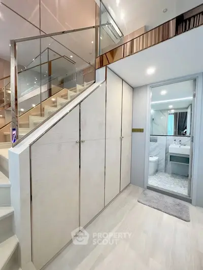 Modern duplex interior with stylish staircase and sleek bathroom design
