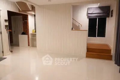 Spacious modern interior with elegant staircase and polished floors