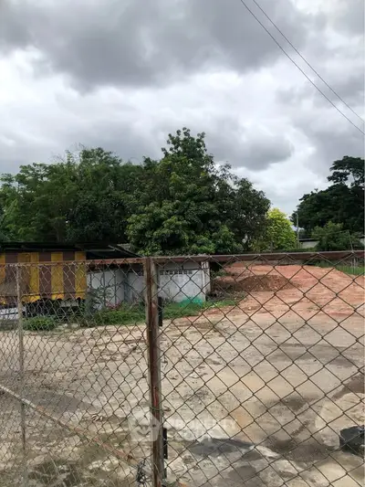 Vacant land with potential for development under cloudy skies