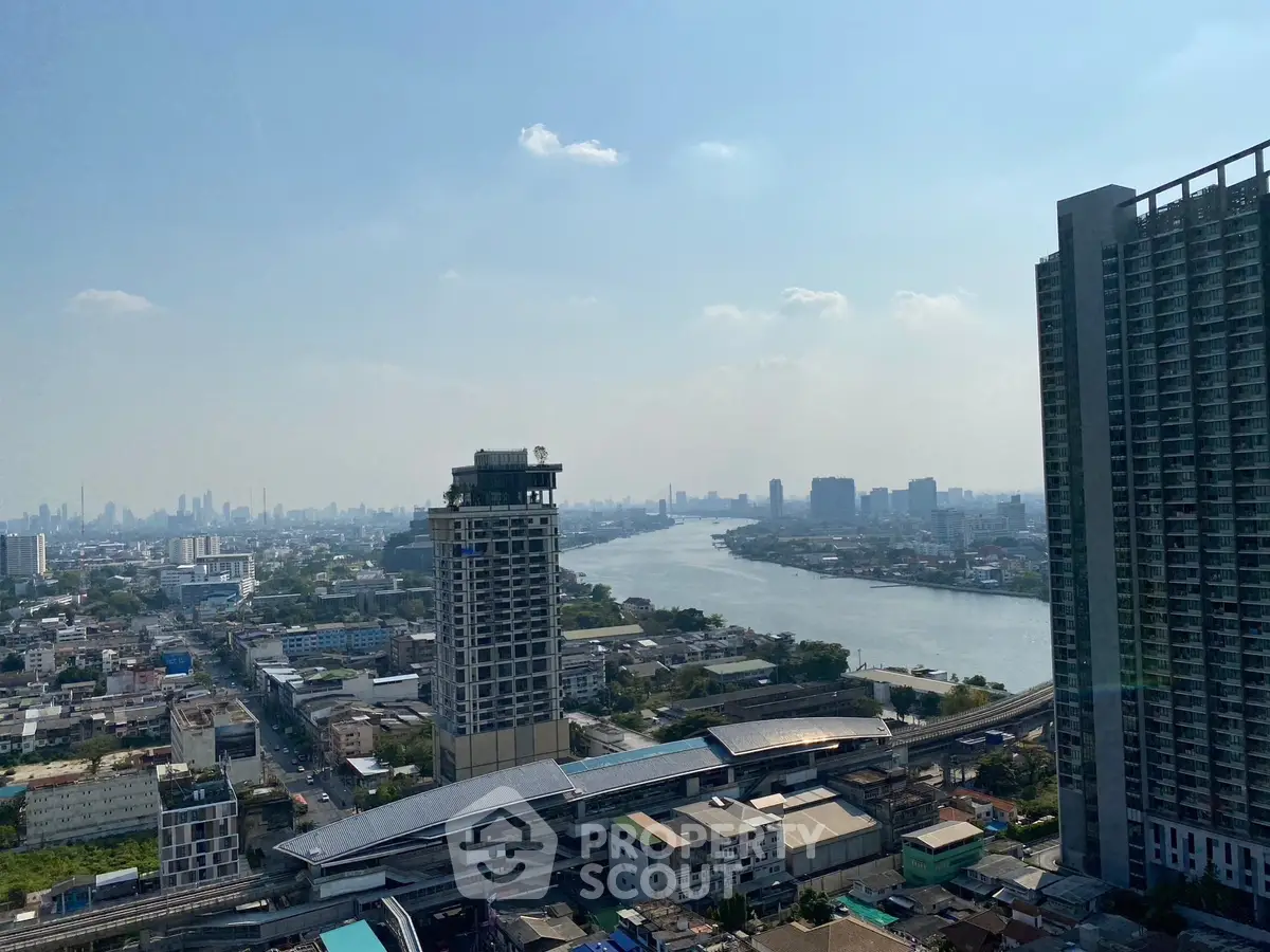 Stunning cityscape view with river and high-rise buildings, perfect for urban living enthusiasts.