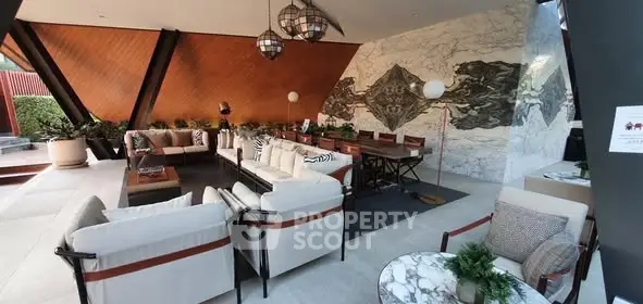 Luxurious outdoor living area with stylish seating and elegant decor