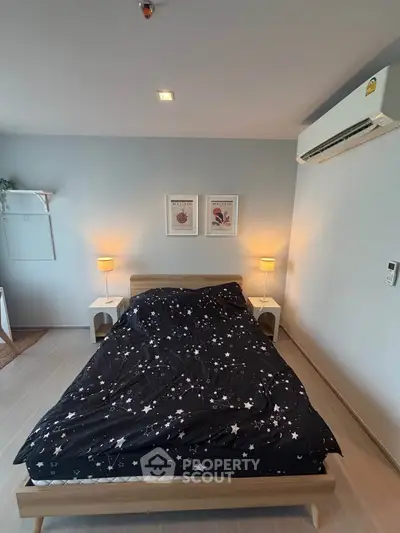 Modern bedroom with stylish decor and cozy ambiance, featuring a comfortable bed and ambient lighting.