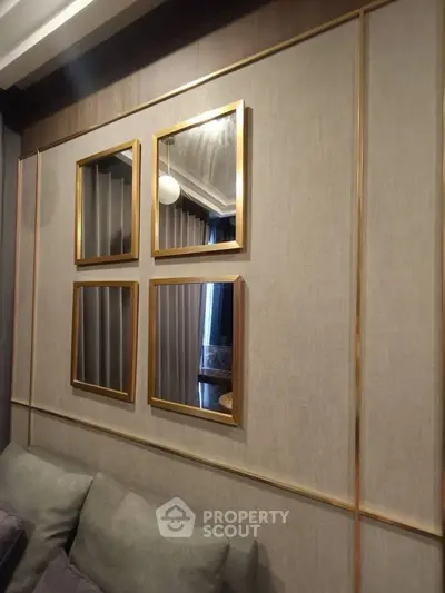 Elegant living room with modern wall decor and plush seating