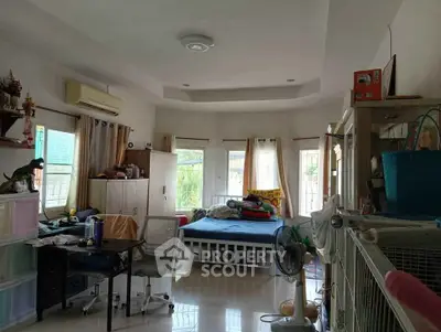 Spacious living room with natural light and versatile layout, ideal for modern living.