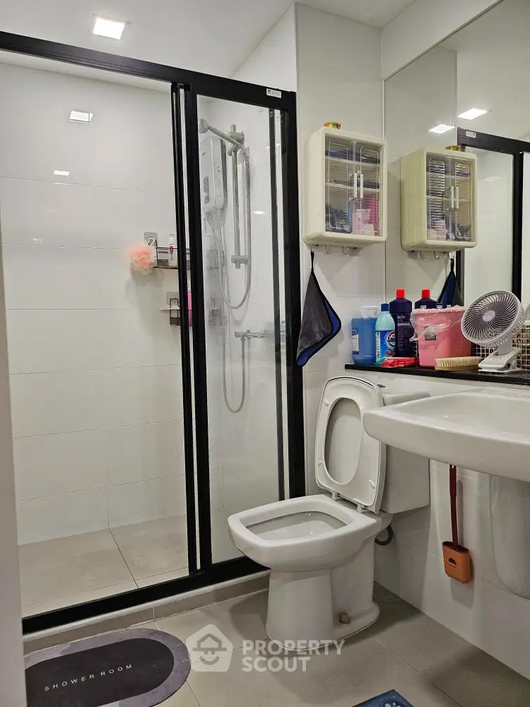 Modern bathroom with shower and toilet in sleek design