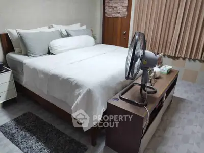 Cozy bedroom with modern decor and a comfortable bed