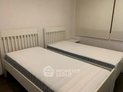 Cozy bedroom with twin beds and minimalist decor