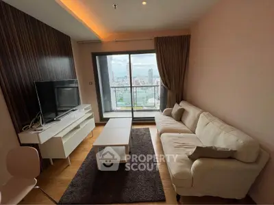 Modern living room with city view, featuring a cozy sofa and sleek entertainment center.