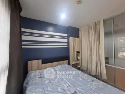 Cozy bedroom with modern decor and ample natural light