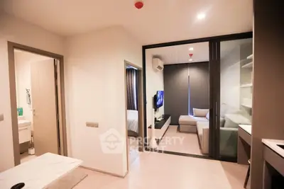 Modern apartment interior with open living room and cozy bedroom