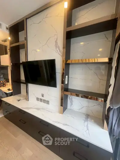Luxurious modern living room with elegant marble wall and sleek TV setup