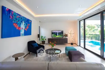 Luxurious living room with modern decor and pool view, featuring elegant furniture and vibrant artwork.