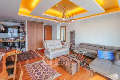 Spacious living room with modern decor and cozy seating area
