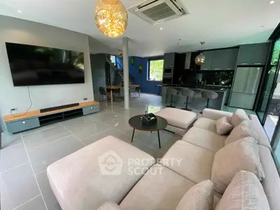 Spacious modern living room with open kitchen and stylish decor