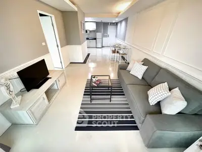 Modern living room with stylish decor and open layout in a contemporary apartment.
