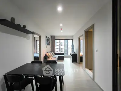 Modern open-plan living room with dining area in a stylish apartment