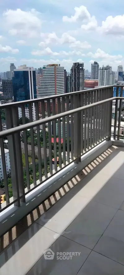 Stunning cityscape view from a modern high-rise balcony, perfect for urban living.
