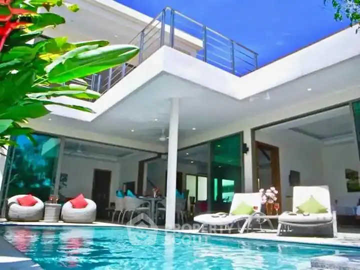 Luxurious modern villa with pool and spacious balcony, perfect for relaxation and entertainment.