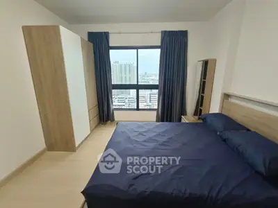 Modern bedroom with city view and stylish furnishings
